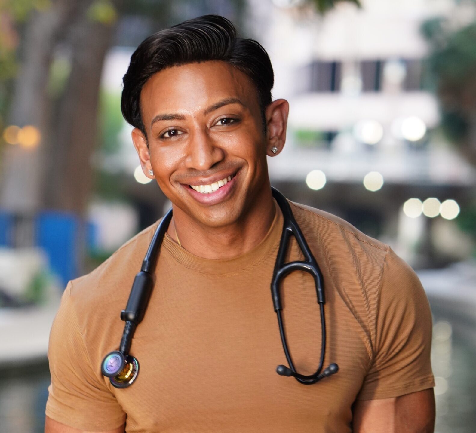 Dr. Shiv Goel on the San Antonio Riverwalk with stethoscope